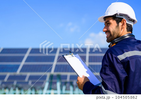 Engineer worker portrait with solar panel at solar farm Engineer worker portrait with solar panel at solar farm 104505862
