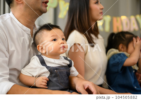 Portrait of happy family spending good time together at home 104505882