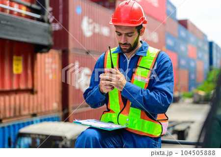 Warehouse engineer worker working at industrial container yard Warehouse engineer worker working at industrial container yard 104505888