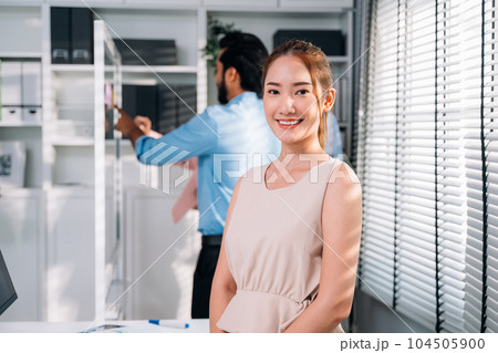 Group of business people working together at modern office 104505900
