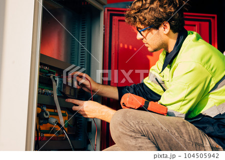Technician engineer holding robot controller checking and repairing machine Technician engineer holding robot controller checking and repairing machine 104505942