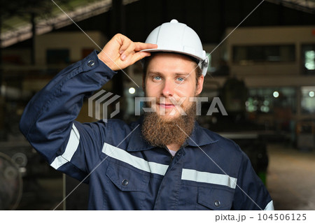 Mechanical engineer repairing engine machine at factory 104506125