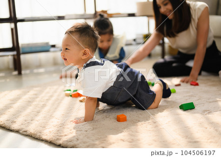 Happy and cheerful family spending good time together at home 104506197