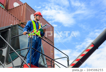 Warehouse engineer worker checking and working at industrial container station Warehouse engineer worker checking and working at industrial container station 104506255
