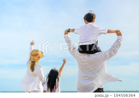 Happy Asian family travel on beach on holiday 104506364