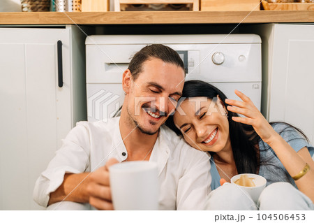 Happy young couple of husband and wife spending time together at home Happy young couple of husband and wife spending time together at home 104506453
