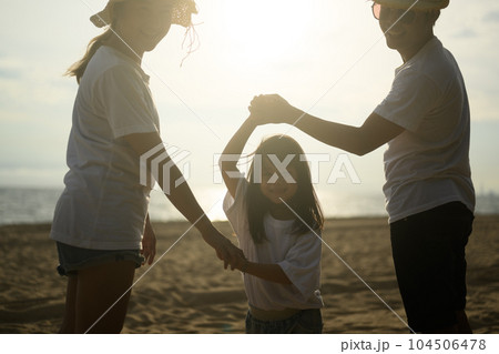 Happy Asian family travel on beach on holiday 104506478
