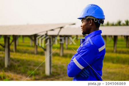 Maintenance engineer installing solar panels on solar cell farm Maintenance engineer installing solar panels on solar cell farm 104506869