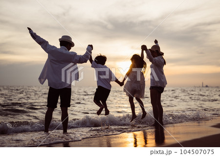 Happy family spending good time together on beach, Family with beach travel Happy family spending good time together on beach, Family with beach travel 104507075