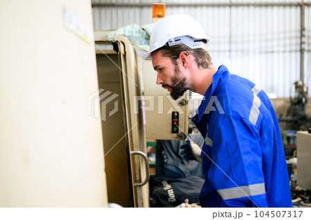 Engineer technician controlling robotic arms on computer laptop 104507317