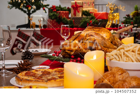 Special food on table in the dinning room for Christmas dinner celebration Special food on table in the dinning room for Christmas dinner celebration 104507352