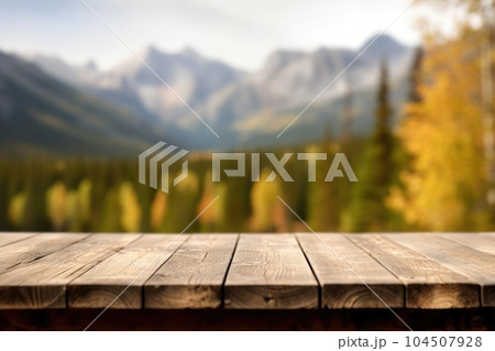 The empty wooden table top with blur background of Alaska nature. Exuberant. The empty wooden table top with blur background of Alaska nature. Exuberant. 104507928