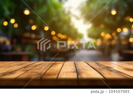 The empty wooden table top with blur background of outdoor cafe. Exuberant. 104507985