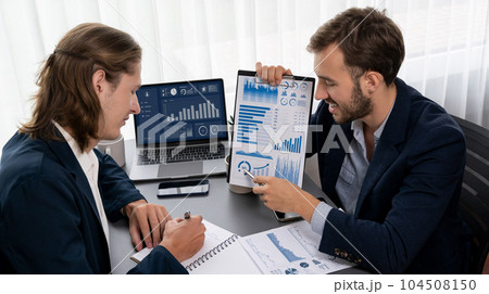 Busy analyst team in office analyzing financial data analysis. Entity Busy analyst team in office analyzing financial data analysis. Entity 104508150