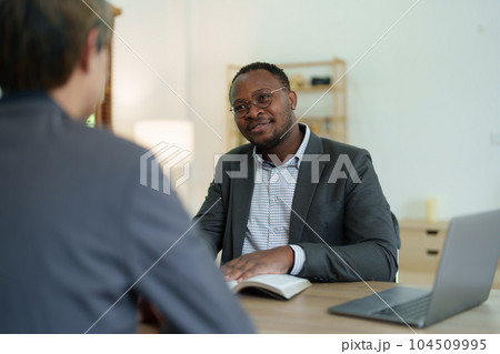 african american attorney, lawyers discussing contract or business agreement at law firm office, Business people making deal document legal, justice advice service concepts. 104509995