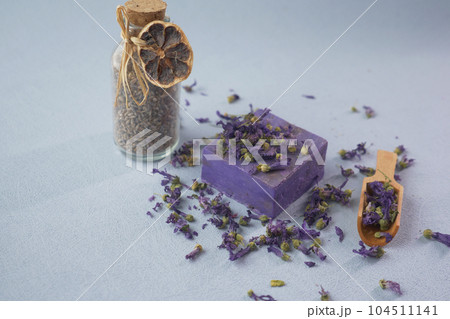 Homemade natural soap bar and lavender flower on white background Homemade natural soap bar and lavender flower on white background 104511141