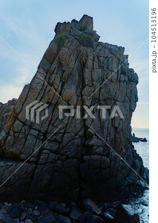 Rocks on the seashore at dawn. Rocks on the seashore at dawn. 104513196