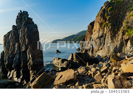 Rocks on the seashore at dawn. Rocks on the seashore at dawn. 104513365