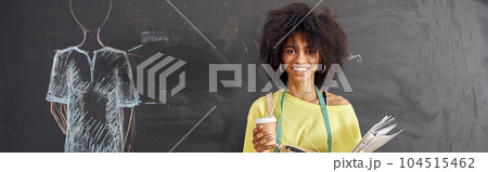 African-American woman teacher with tape measure, cup and papers African-American woman teacher with tape measure, cup and papers 104515462