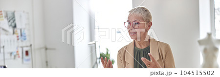 Fashion designer with glasses and pin pillow in wrist shoots vid 104515502