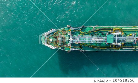 Aerial top view ship tanker crude oil on the sea for transportation, Sea transportation of crude oil petroleum tanker to oil terminal for loading and global business loogistic. Aerial top view ship tanker crude oil on the sea for transportation, Sea transportation of crude oil petroleum tanker to oil terminal for loading and global business loogistic. 104519556