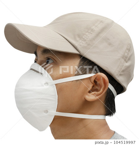 Close up of young male wearing protective face mask on white background. Close up of young male wearing protective face mask on white background. 104519997