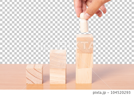 Hand chooses people standing with stacking wooden block. 104520293