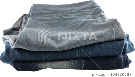 Many jeans stacked. 104520588