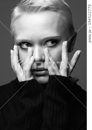 black and white portrait of Short Hair Beautiful young woman with white snow brows 104522778