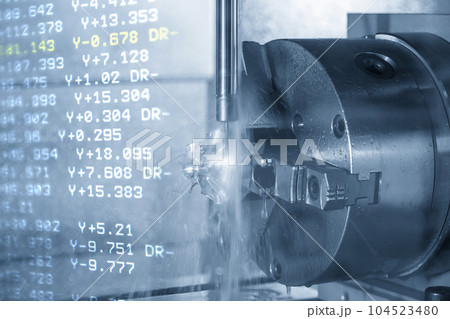 The abstract scene the 5-axis machining center cutting turbine blade parts and NC data background. 104523480