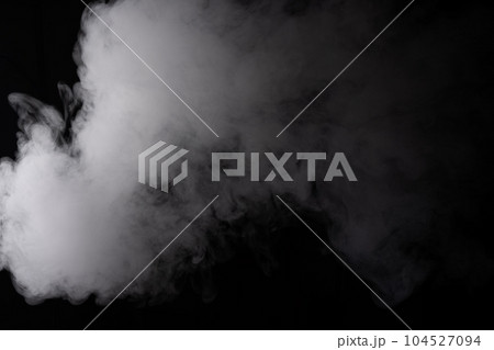 Cloud of white smoke on a black background closeup Cloud of white smoke on a black background closeup 104527094