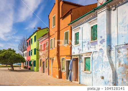 The Burano island with a colorful houses near Venice, Italy. The Burano island with a colorful houses near Venice, Italy. 104528141