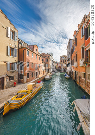The canal in Venice historic old town at sunny day, Italy. The canal in Venice historic old town at sunny day, Italy. 104528229
