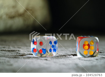 Close-up of dice made of transparent plastic 104528763