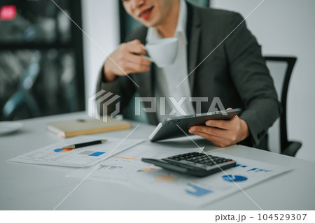business owner or Asian female marketers are using tablet computer in office work. business owner or Asian female marketers are using tablet computer in office work. 104529307
