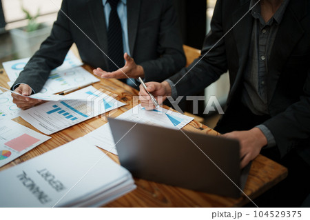 Asian business advisor meeting to analyze and discuss the situation on the financial report in the meeting room.Investment Consultant, Financial , teamwork ,brainstorming ,startup and accounting. Asian business advisor meeting to analyze and discuss the situation on the financial report in the meeting room.Investment Consultant, Financial , teamwork ,brainstorming ,startup and accounting. 104529375