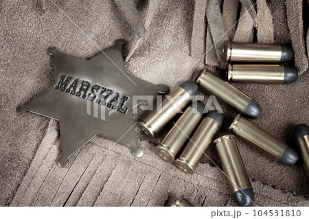 Old west marshal badge with ammunition 104531810
