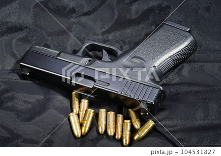 Police hand gun on black uniform Police hand gun on black uniform 104531827
