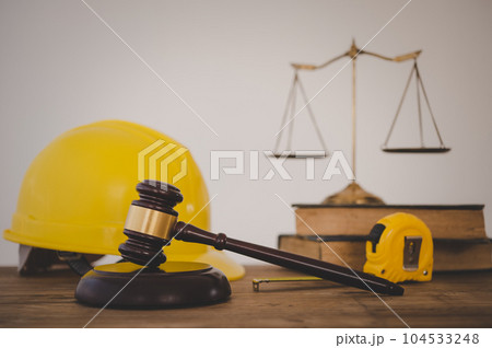 Judge's hammer and helmet Law and Justice about labor law concept Construction law.. Judge's hammer and helmet Law and Justice about labor law concept Construction law.. 104533248
