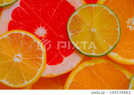 Citrus fruits slices - orange, grapefruit, lemon and lime - close up, top view Citrus fruits slices - orange, grapefruit, lemon and lime - close up, top view 104534863