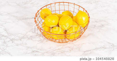 Ingredients in glass mixing bowls to prepare lemon bundt cake. 104540820
