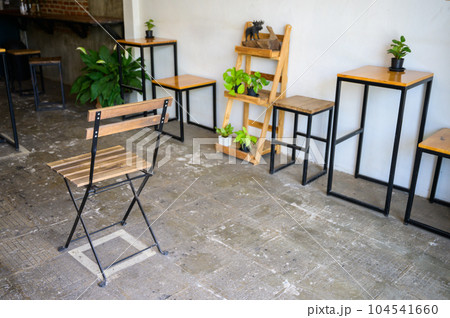 An empty chairs without nobody sitting on it, keep spaced between each chairs make separate for social distancing to avoid spreading of Covid-19. Social distance concept. An empty chairs without nobody sitting on it, keep spaced between each chairs make separate for social distancing to avoid spreading of Covid-19. Social distance concept. 104541660