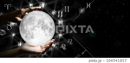 Astrological zodiac signs over the moon in hand. Knowledge of the stars in the sky. The power of the universe concept. Astrological zodiac signs over the moon in hand. Knowledge of the stars in the sky. The power of the universe concept. 104541857