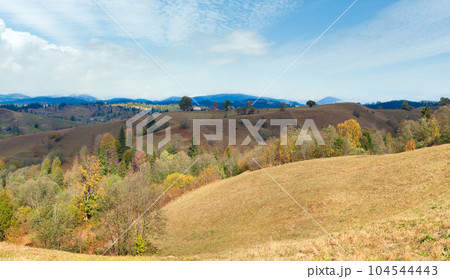 Beautiful autumn mountain panorama and village on mountainside (Carpathian, Ukraine). Beautiful autumn mountain panorama and village on mountainside (Carpathian, Ukraine). 104544443