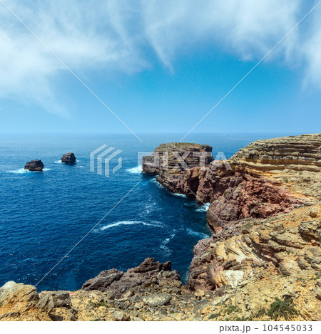 Summer Atlantic rocky coast (Algarve, Portugal). Summer Atlantic rocky coast (Algarve, Portugal). 104545033
