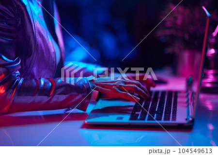 Closeup on woman with laptop 104549613