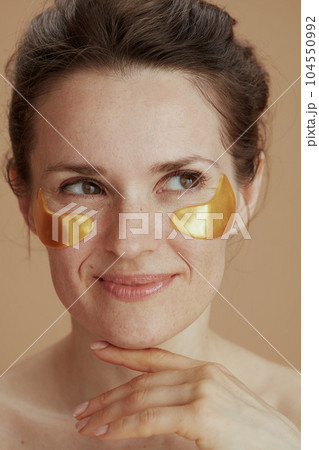 smiling woman with eye patches 104550992