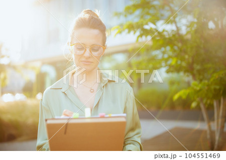 modern woman worker in green blouse and eyeglasses 104551469
