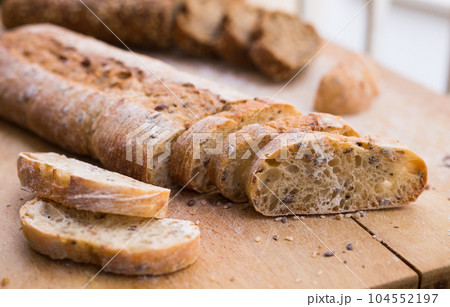 fresh loaf of bread on wooden board fresh loaf of bread on wooden board 104552197