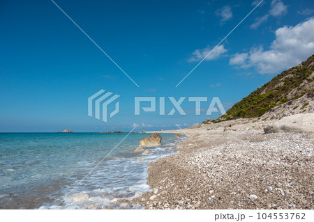 Pebble sunny beach on Lefkada island in Greece 104553762